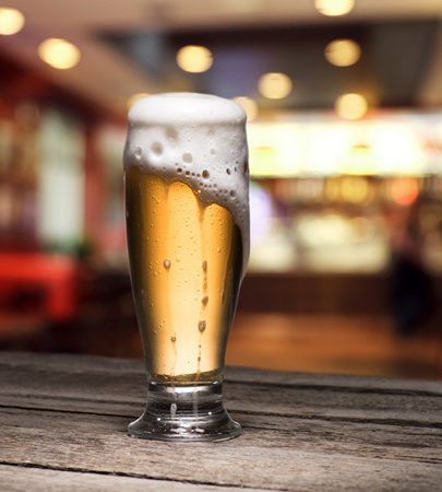 selective-focus-of-mug-of-beer-standing-on-wooden-2026-01-06-00-45-29-utc